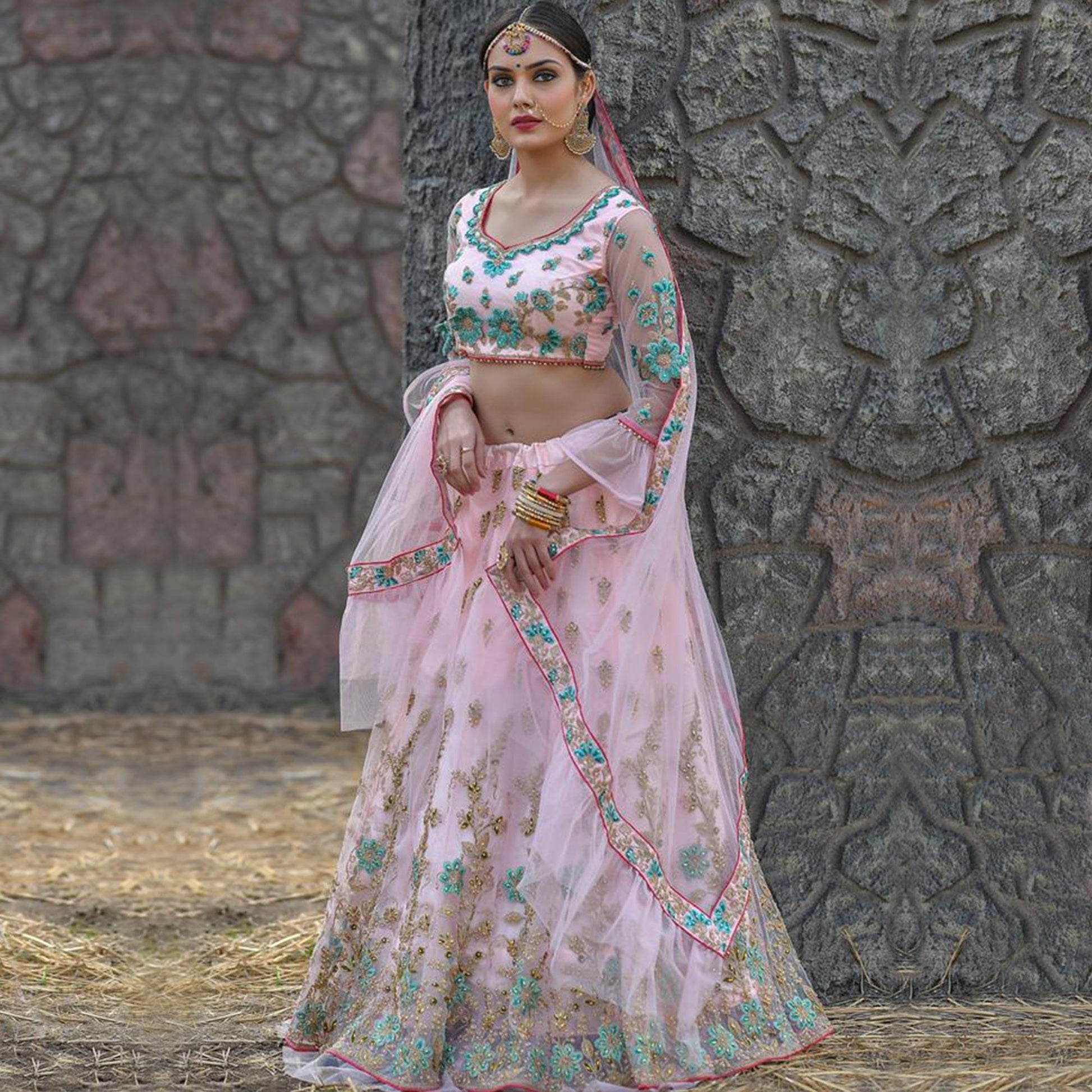 Excellent Baby Pink Colored Party Wear Embroidered Net Lehenga Choli