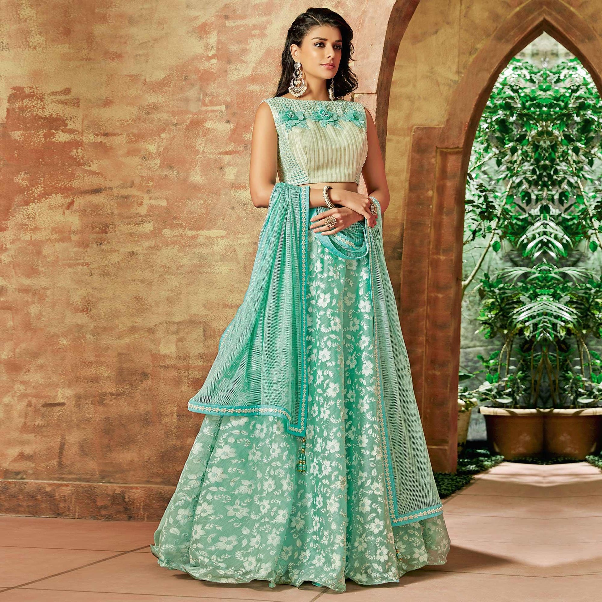 Excellent Sea Green Colored Partywear Embroidered Tissue Lehenga Choli