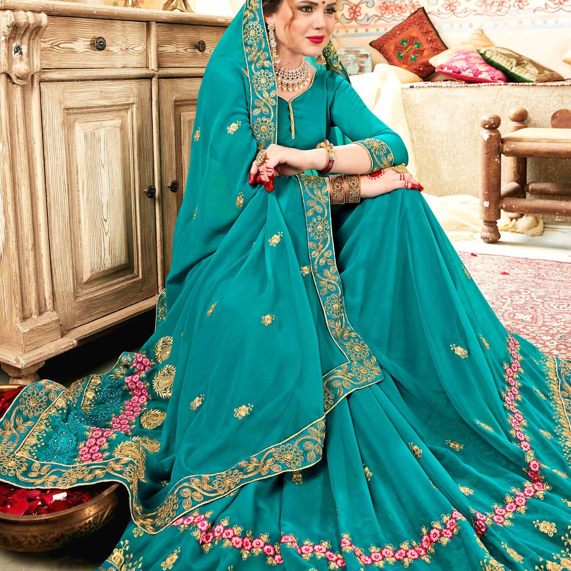 Exceptional Aqua Blue Colored Partywear Embroidered Georgette Saree