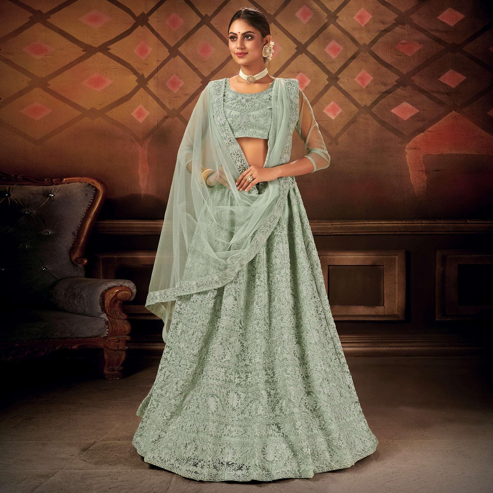 Exceptional Pastel Green Colored Partywear Embroidered Net Lehenga Choli