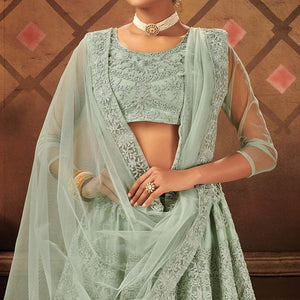 Exceptional Pastel Green Colored Partywear Embroidered Net Lehenga Choli