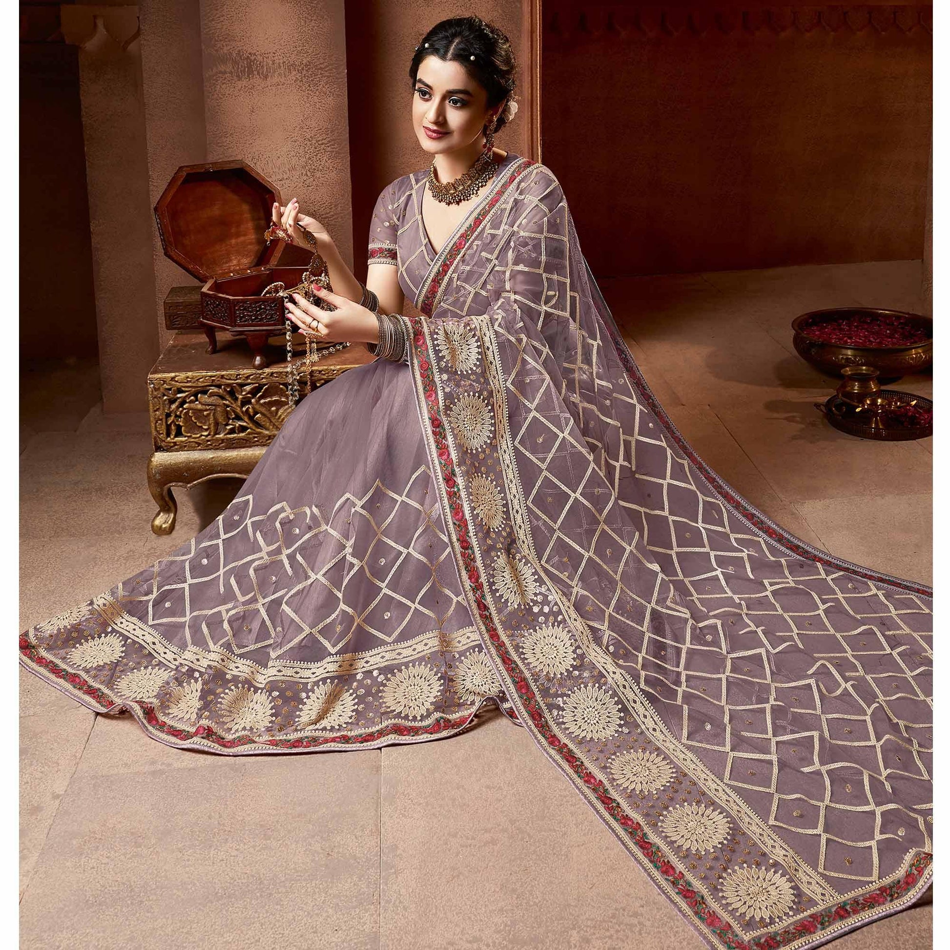 Exclusive Mauve Coloured Partywear Embroidered Soft Net Saree