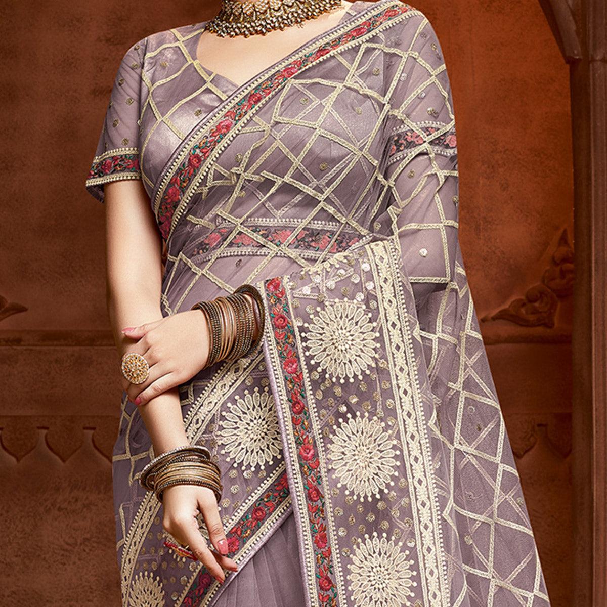 Exclusive Mauve Coloured Partywear Embroidered Soft Net Saree
