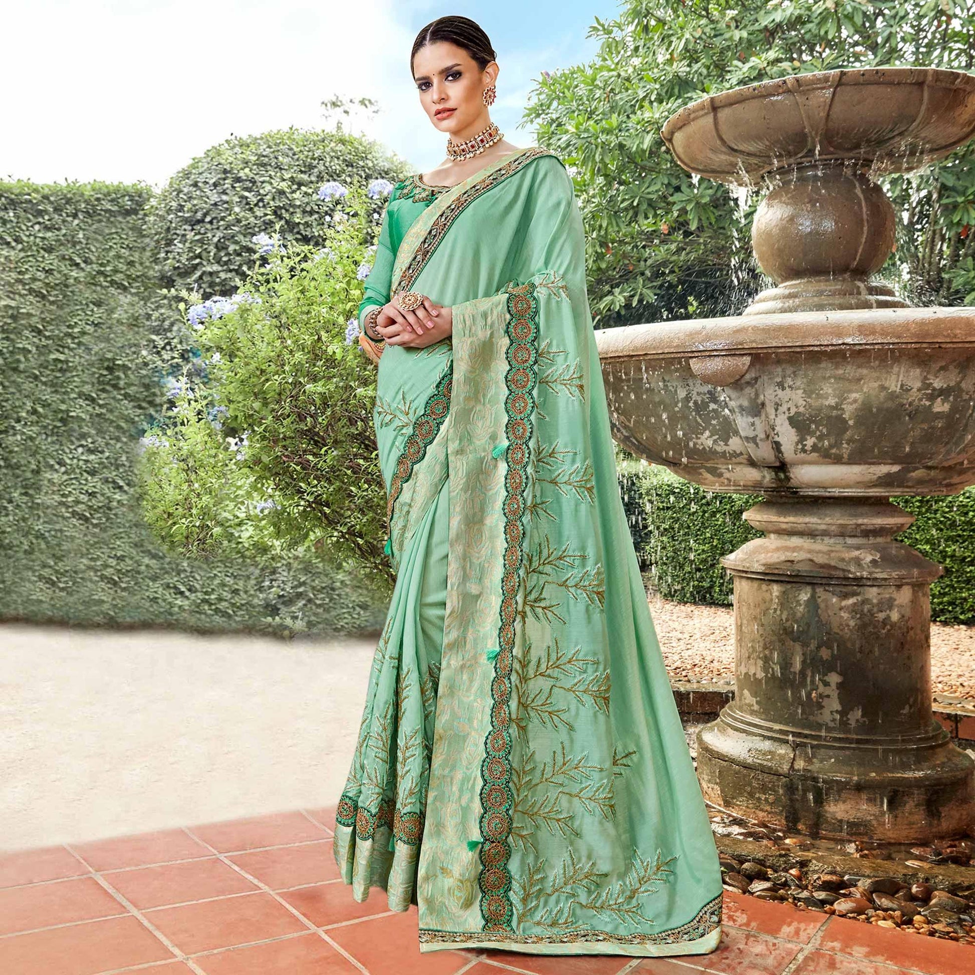 Exotic Aqua Green Colored Partywear Embroidered Georgette Saree