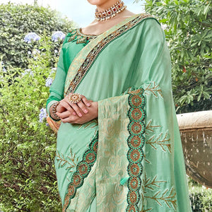 Exotic Aqua Green Colored Partywear Embroidered Georgette Saree