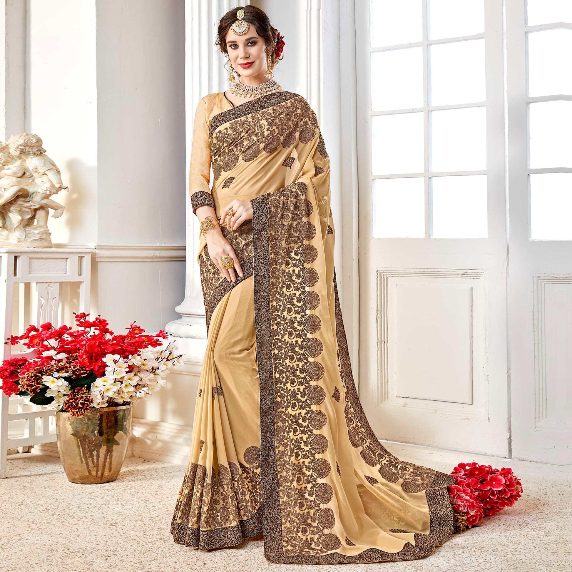 Exotic Beige Colored Partywear Embroidered Georgette Saree