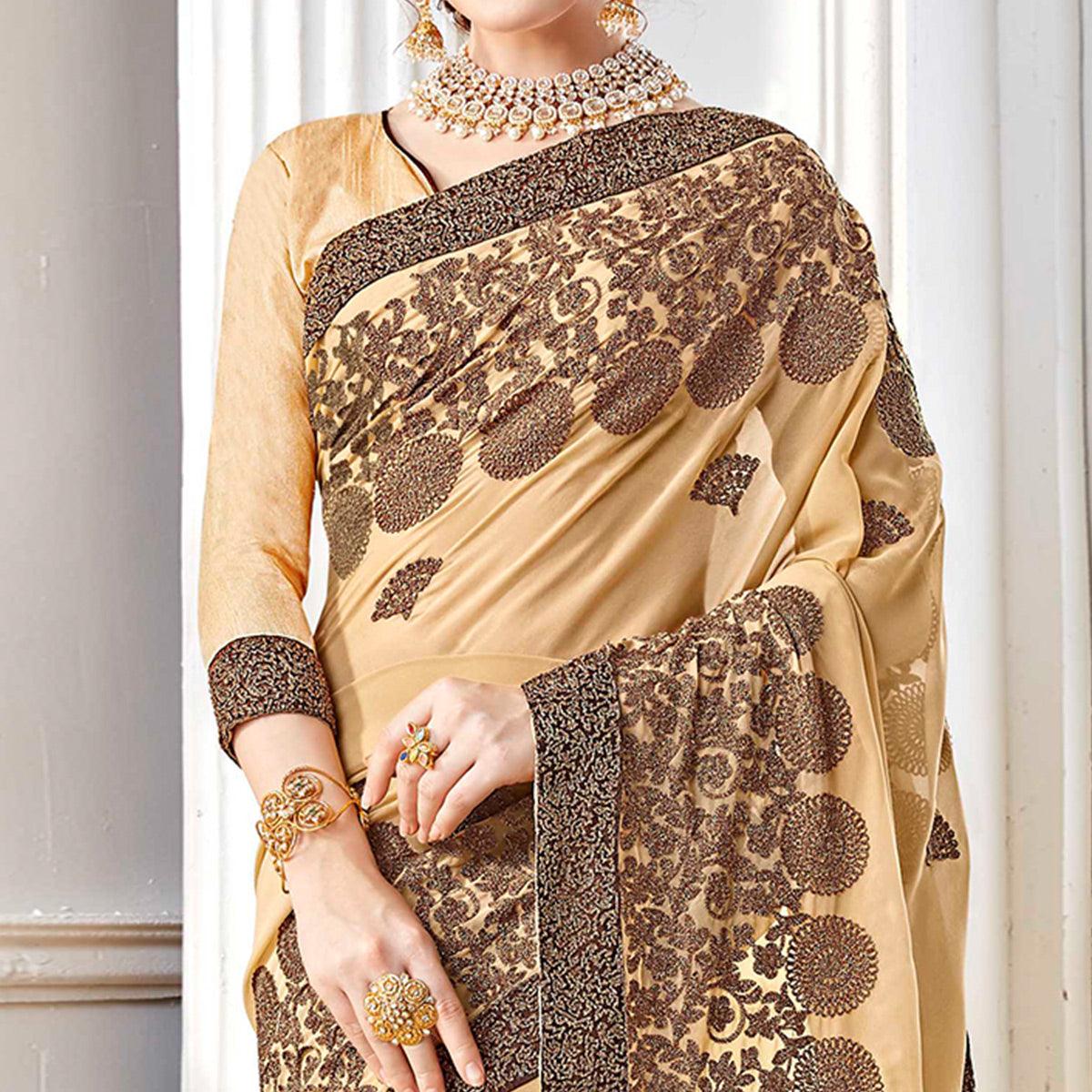 Exotic Beige Colored Partywear Embroidered Georgette Saree