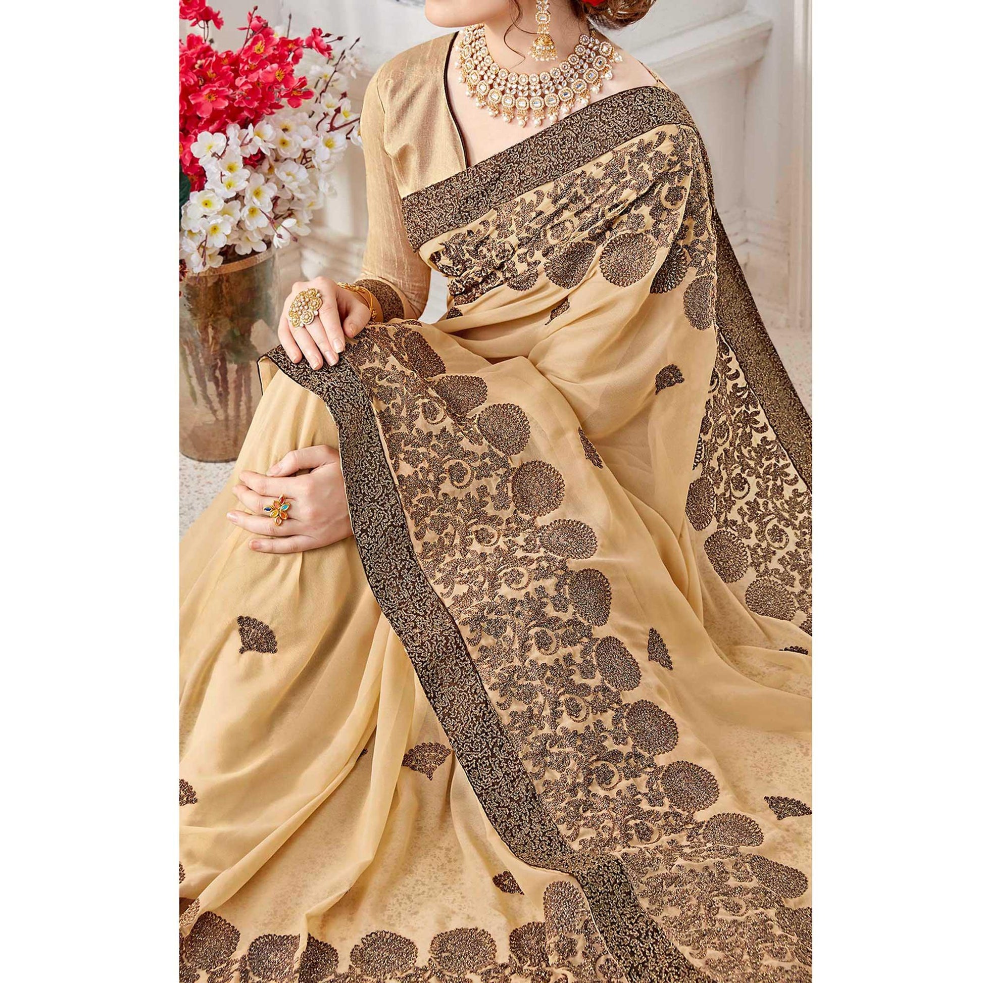 Exotic Beige Colored Partywear Embroidered Georgette Saree
