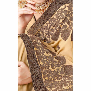 Exotic Beige Colored Partywear Embroidered Georgette Saree