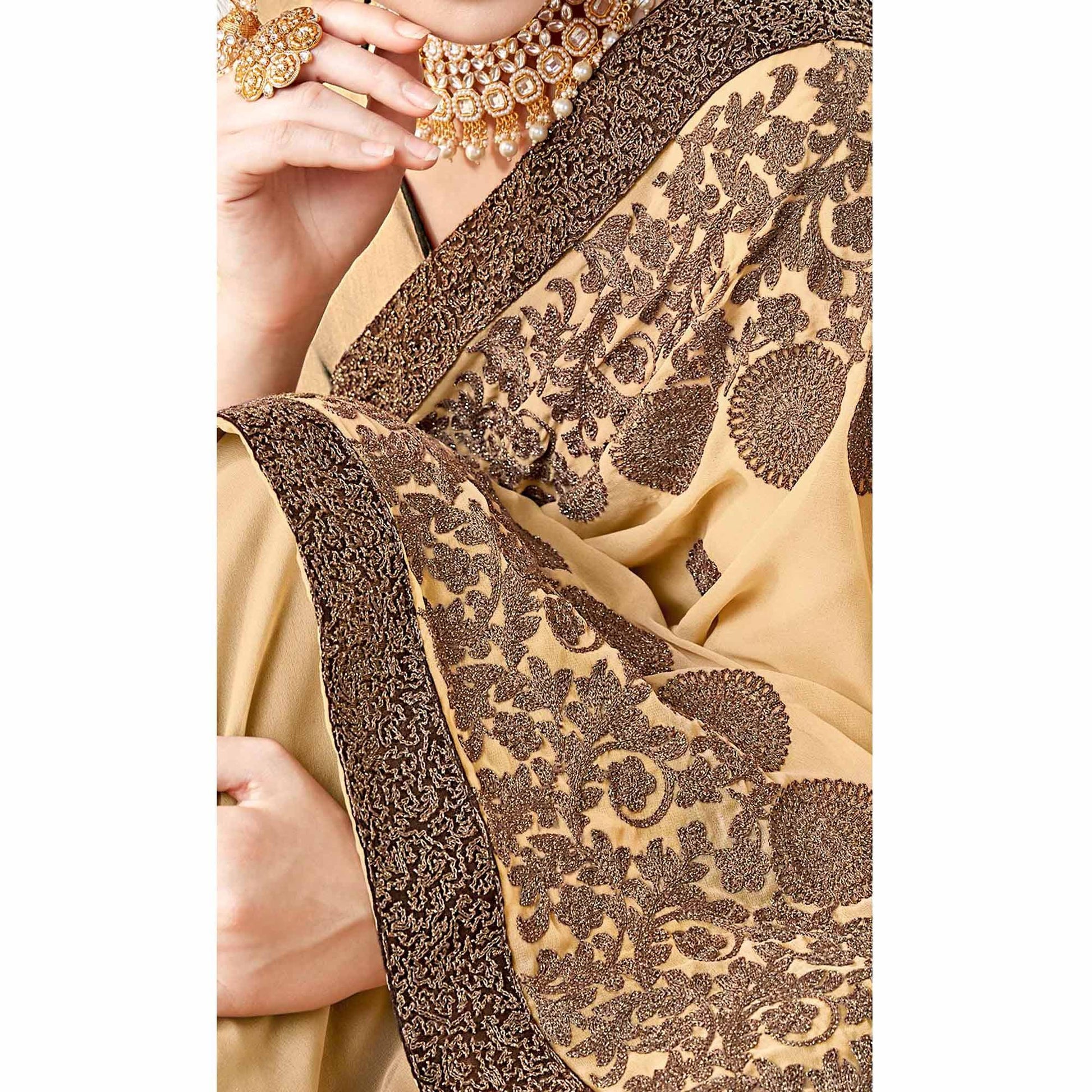 Exotic Beige Colored Partywear Embroidered Georgette Saree