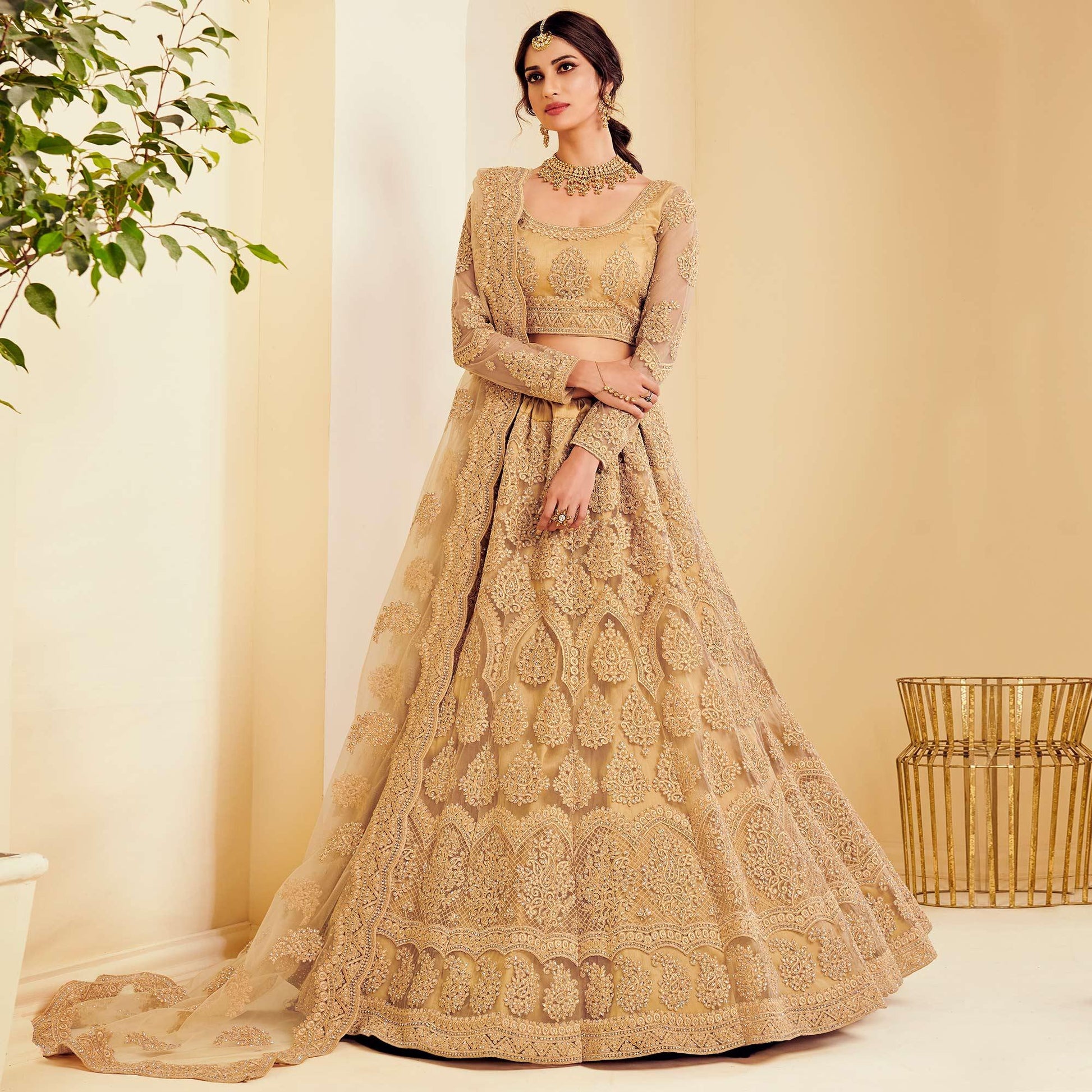 Exotic Golden Coloured Wedding Wear Cording Embroidered Net Lehenga Choli