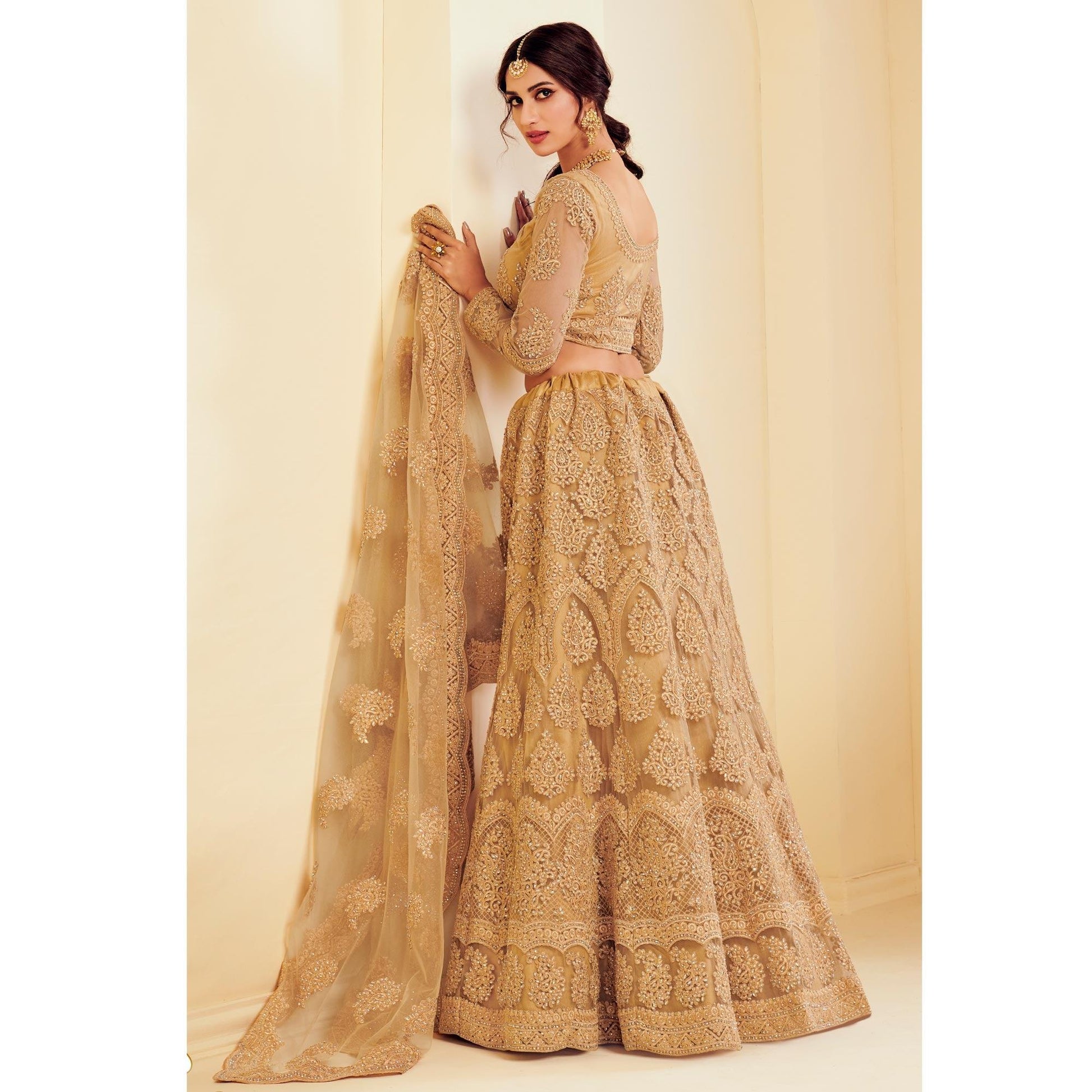 Exotic Golden Coloured Wedding Wear Cording Embroidered Net Lehenga Choli