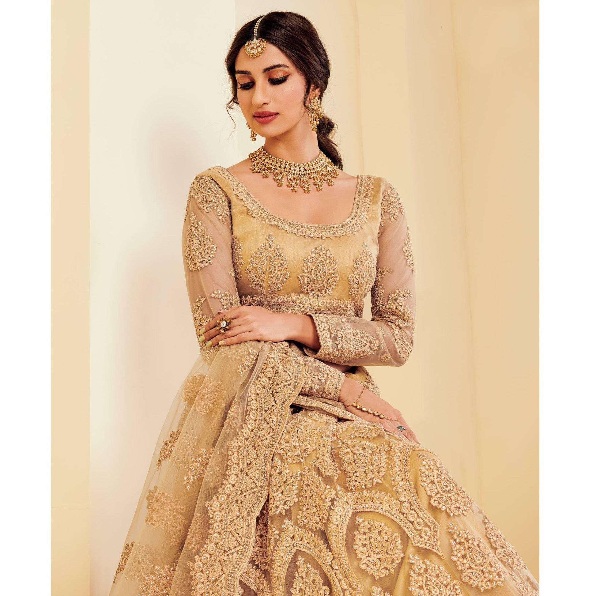 Exotic Golden Coloured Wedding Wear Cording Embroidered Net Lehenga Choli