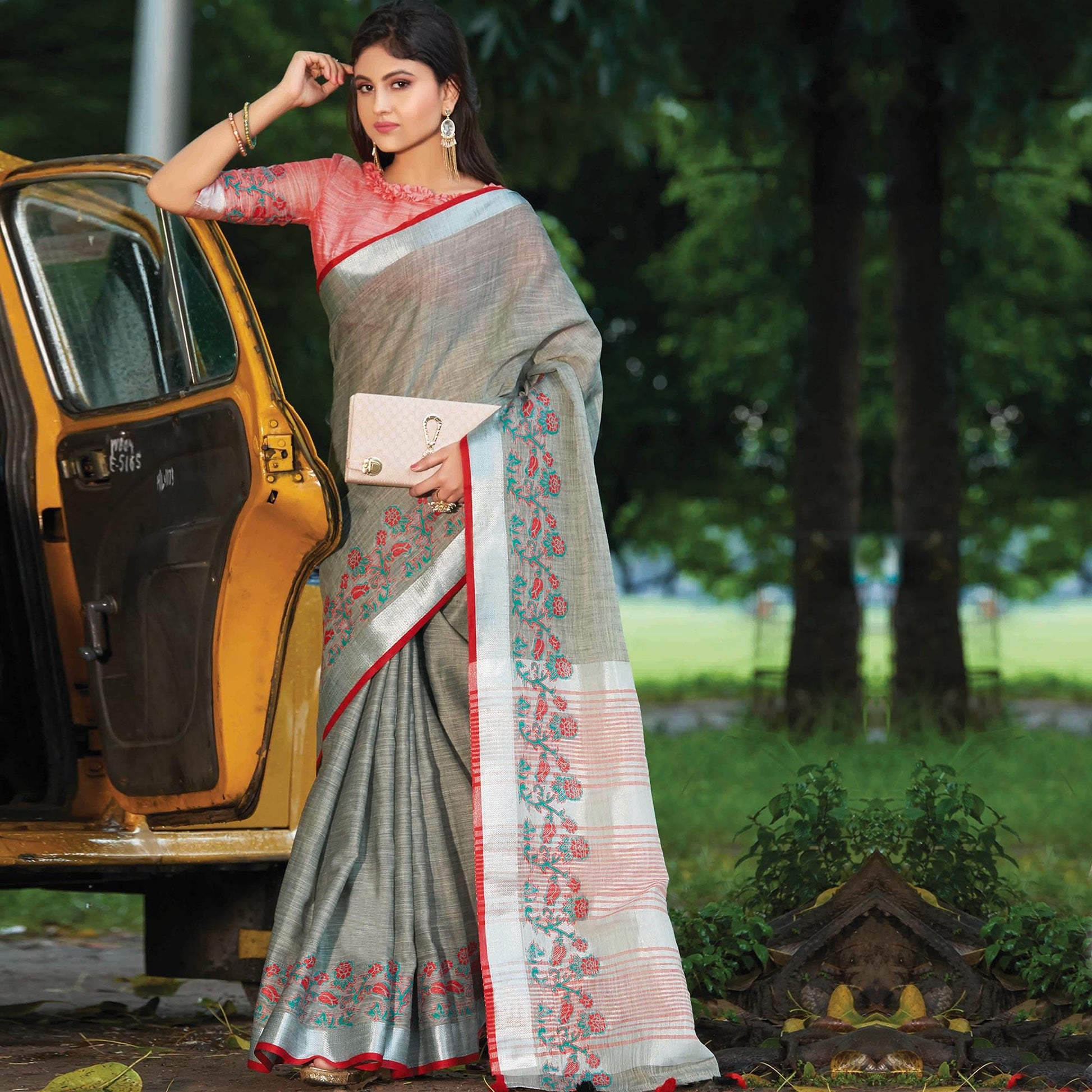 Exotic Grey Colored Festive Wear Floral Embroidered Linen Saree With Tassels