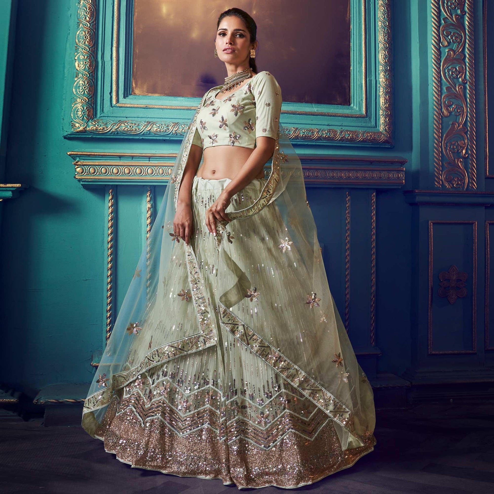Exotic Pastel Green Colored Partywear Embroidered Soft Net Lehenga Choli