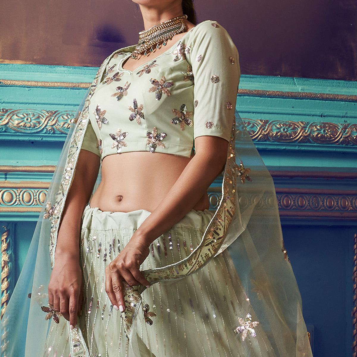 Exotic Pastel Green Colored Partywear Embroidered Soft Net Lehenga Choli