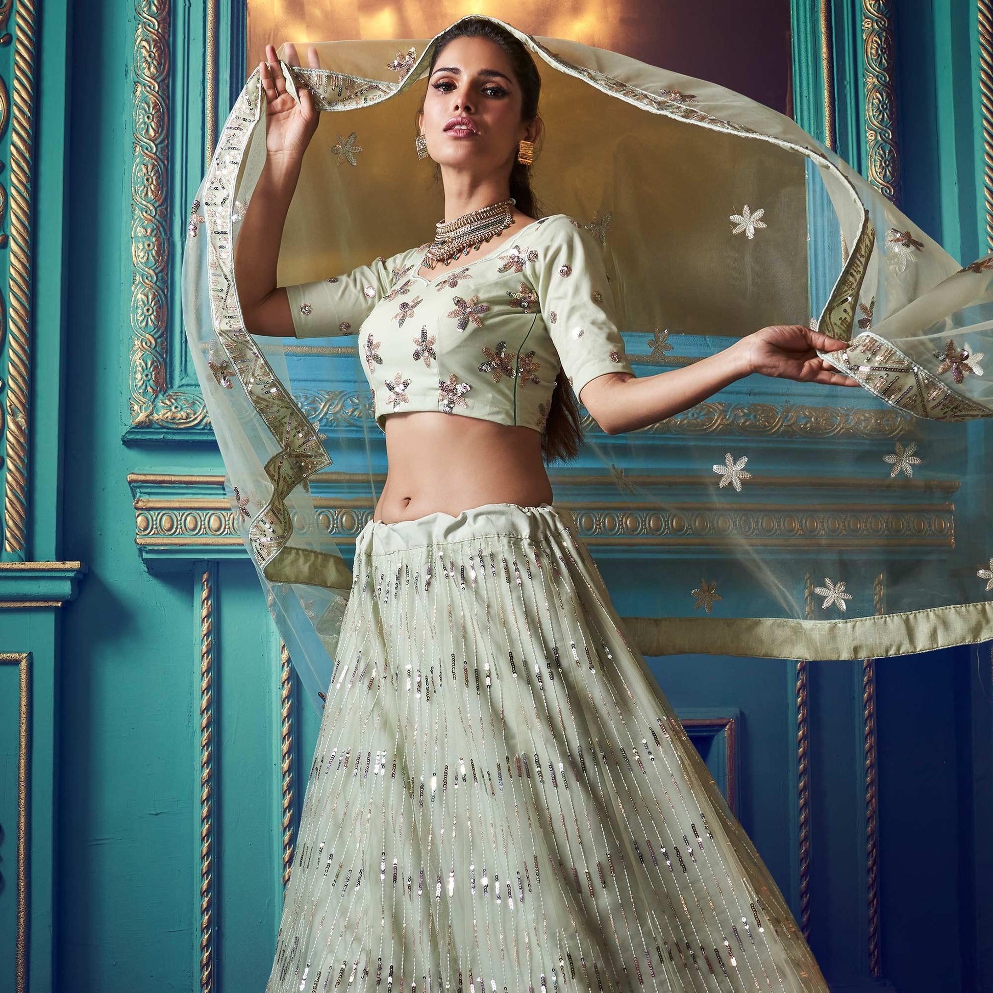 Exotic Pastel Green Colored Partywear Embroidered Soft Net Lehenga Choli