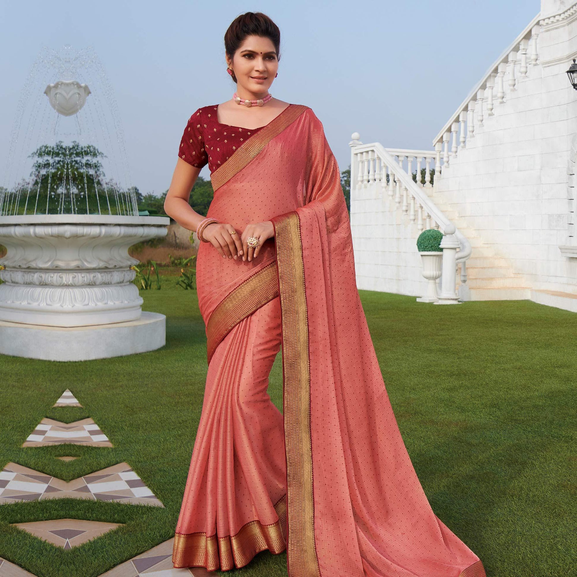 Exotic Peach Colored Party Wear Embroidered Chiffon Saree