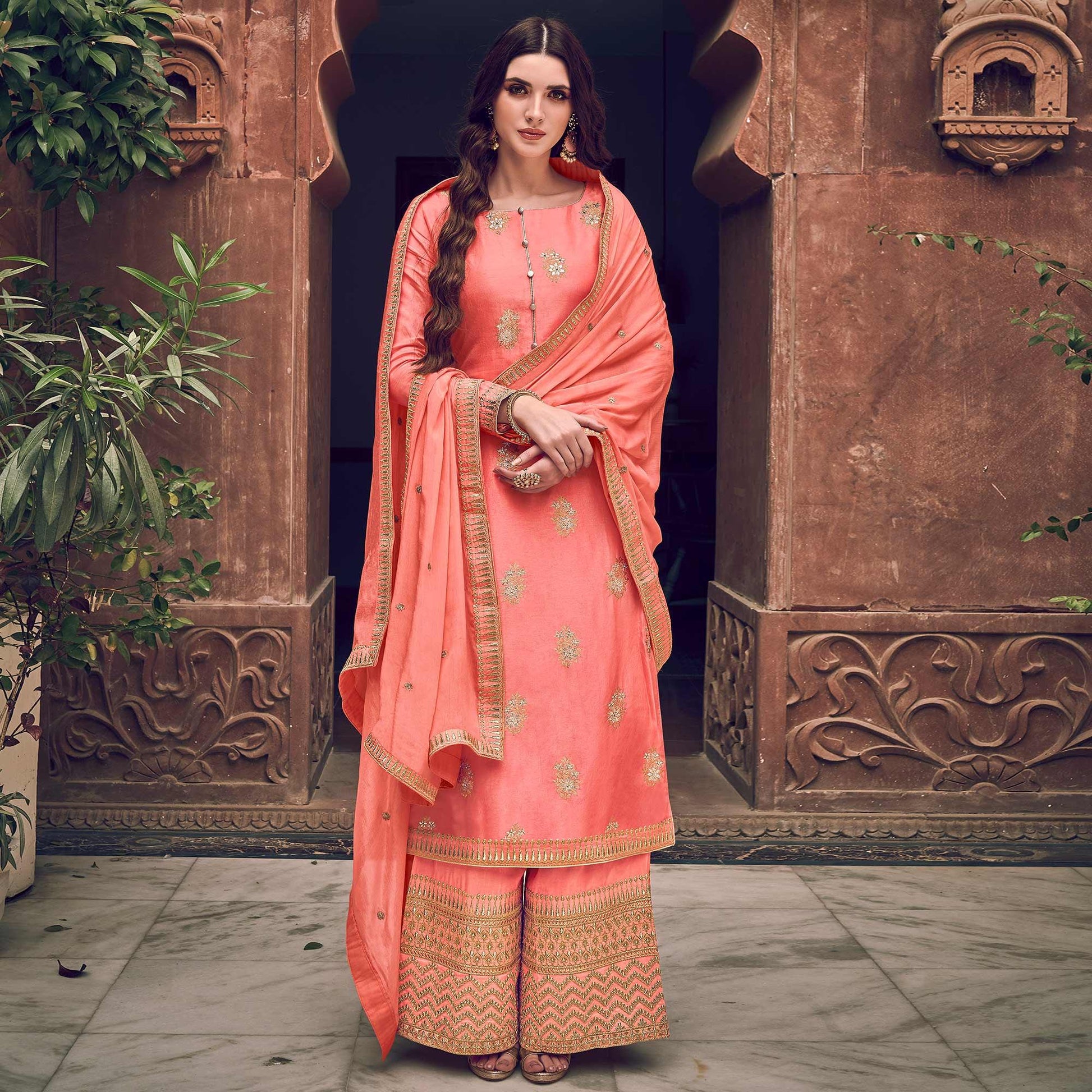 Exotic Peach Colored Partywear Embroidered Pure Dola Jacquard Palazzo Suit