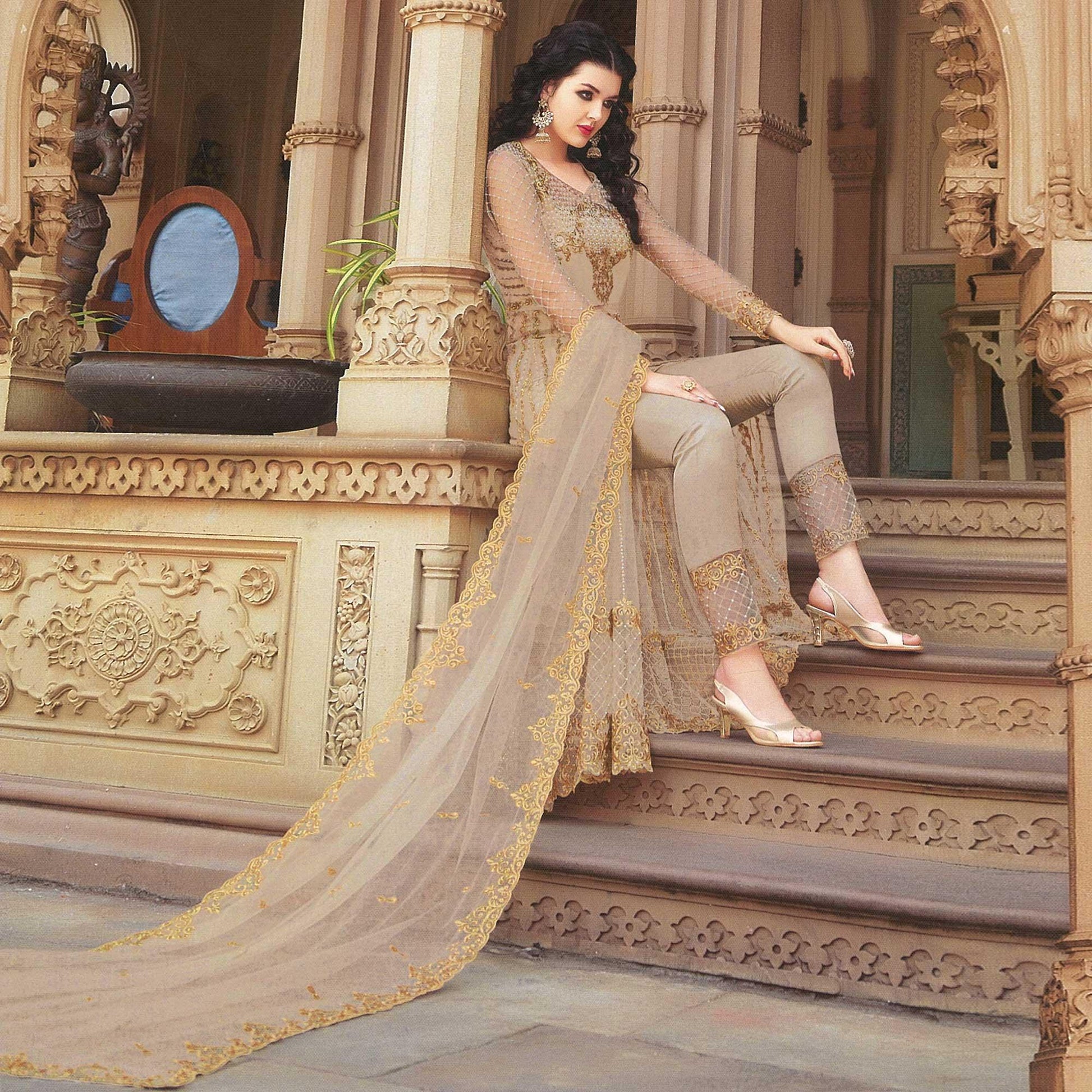 Eye-catching Beige Colored Partywear Embroidered Netted Anarkali With Dual Bottom