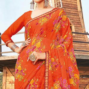 Eye-catching Orange Coloured Partywear Pure Georgette Floral Printed Saree With Fancy Lace Border