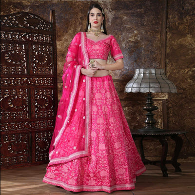Eye-catching Pink Colored Partywear Embroidered Silk Lehenga Choli