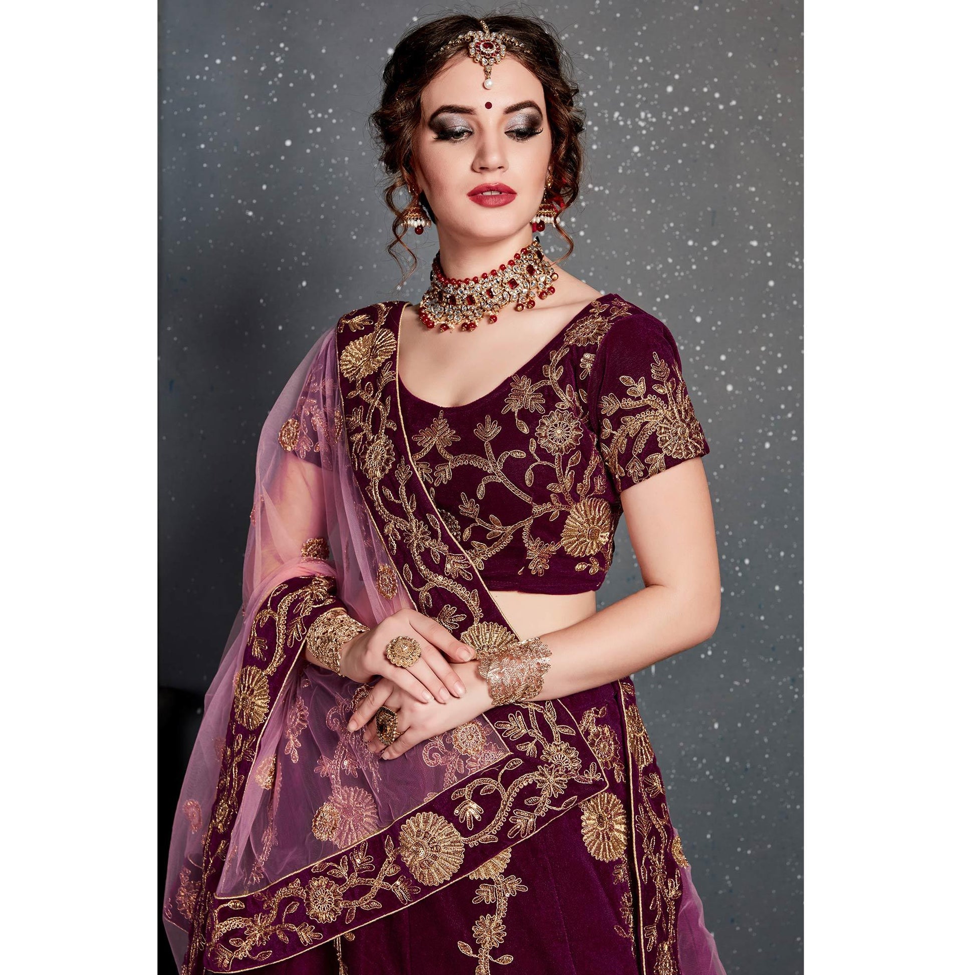 Eye-catching Purple Colored Wedding Wear Embroidered Velvet Lehenga Choli