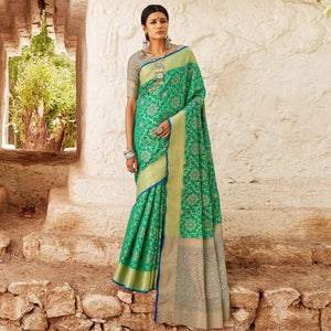 Eye-catching Turquoise Green Colored Festive Wear Woven Silk Saree