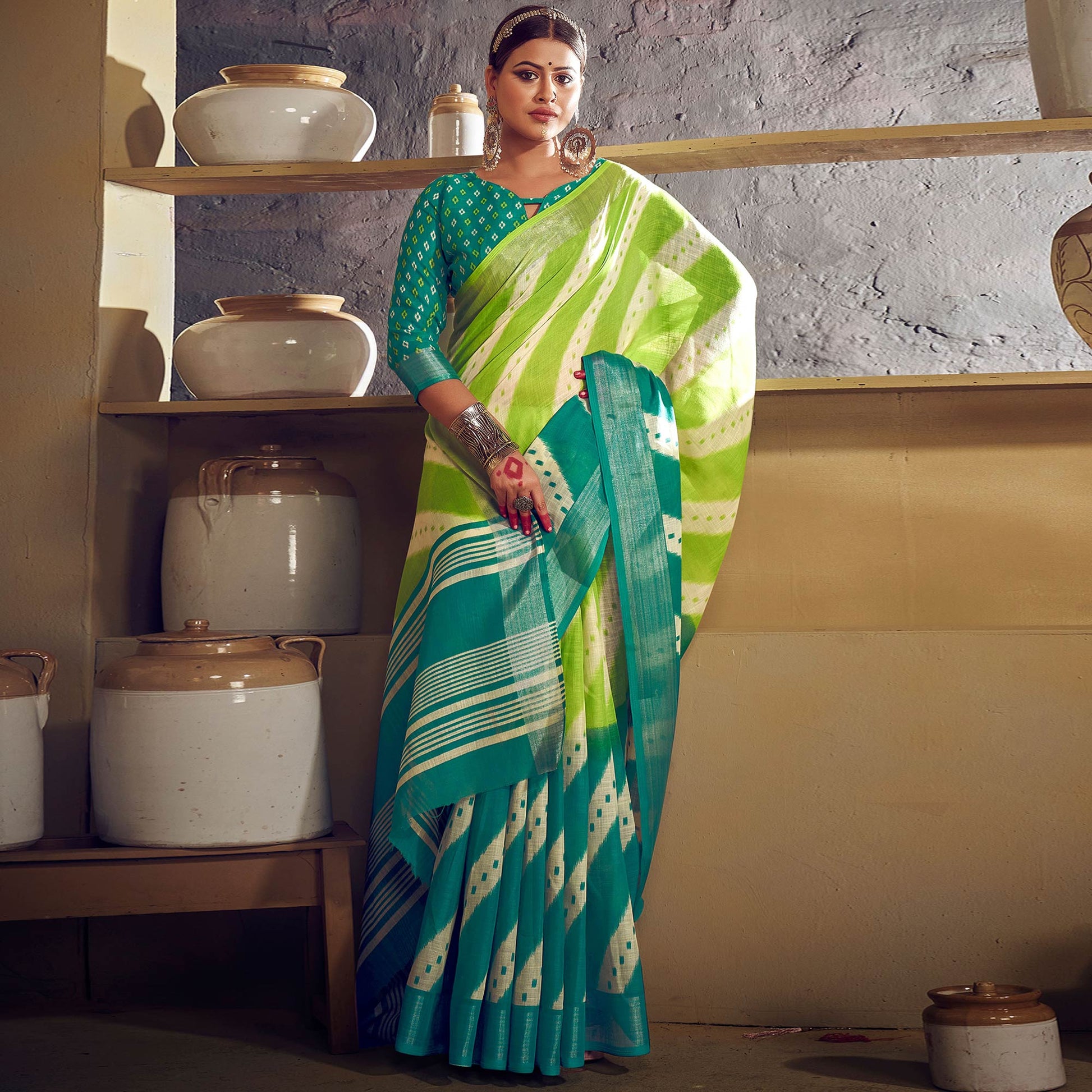 green-blue-printed-with-zari-border-linen-saree