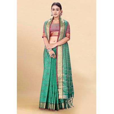 green-woven-patola-art-silk-saree-with-tassels-3