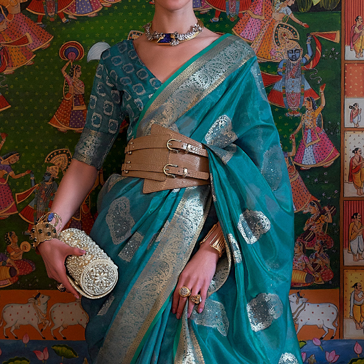 Blue Woven Organza Saree With Tassels