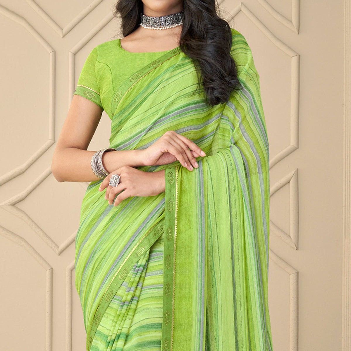 green-printed-chiffon-saree-with-tassels