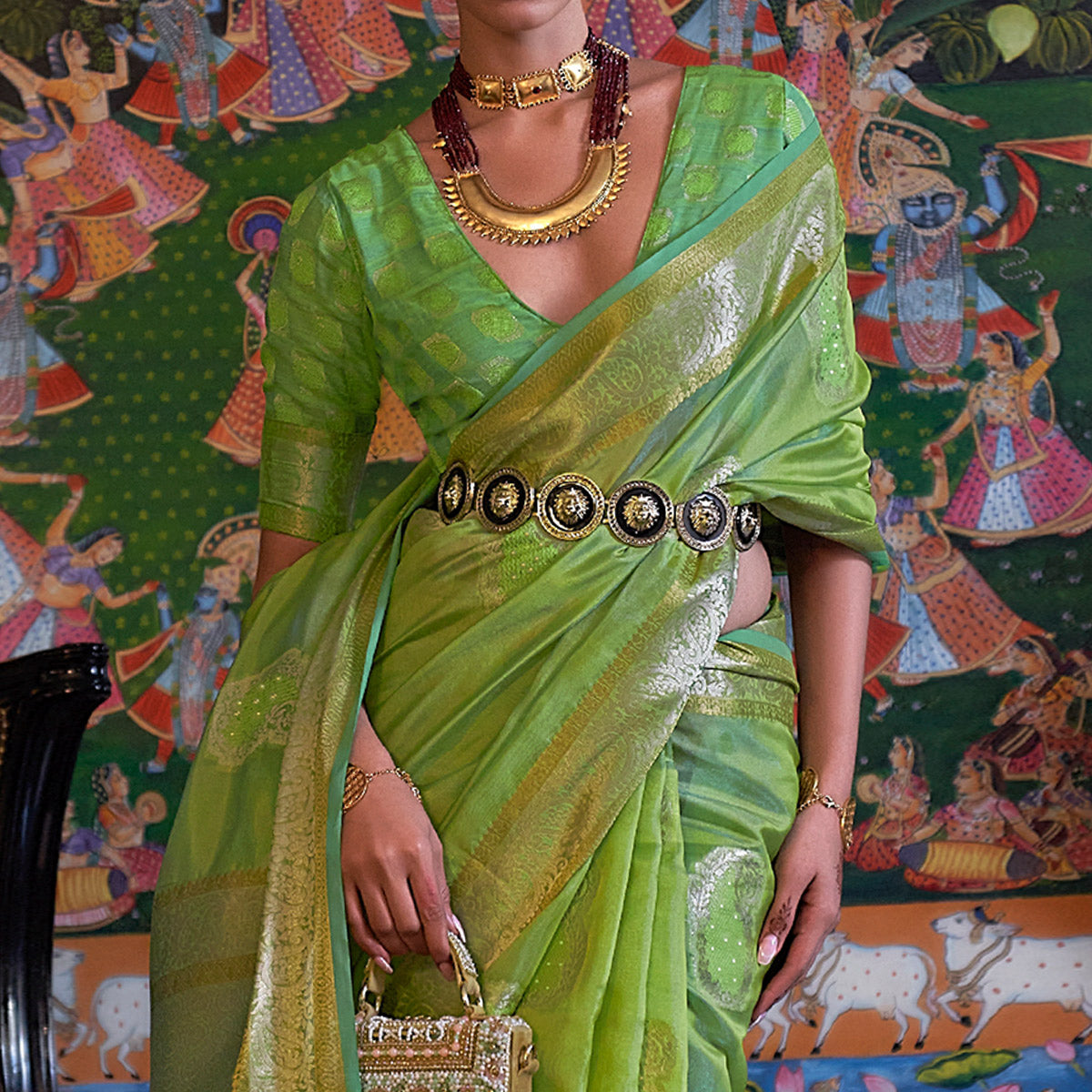 1-green-woven-organza-saree-with-tassels