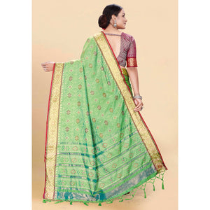 green-woven-patola-art-silk-saree-with-tassels-2