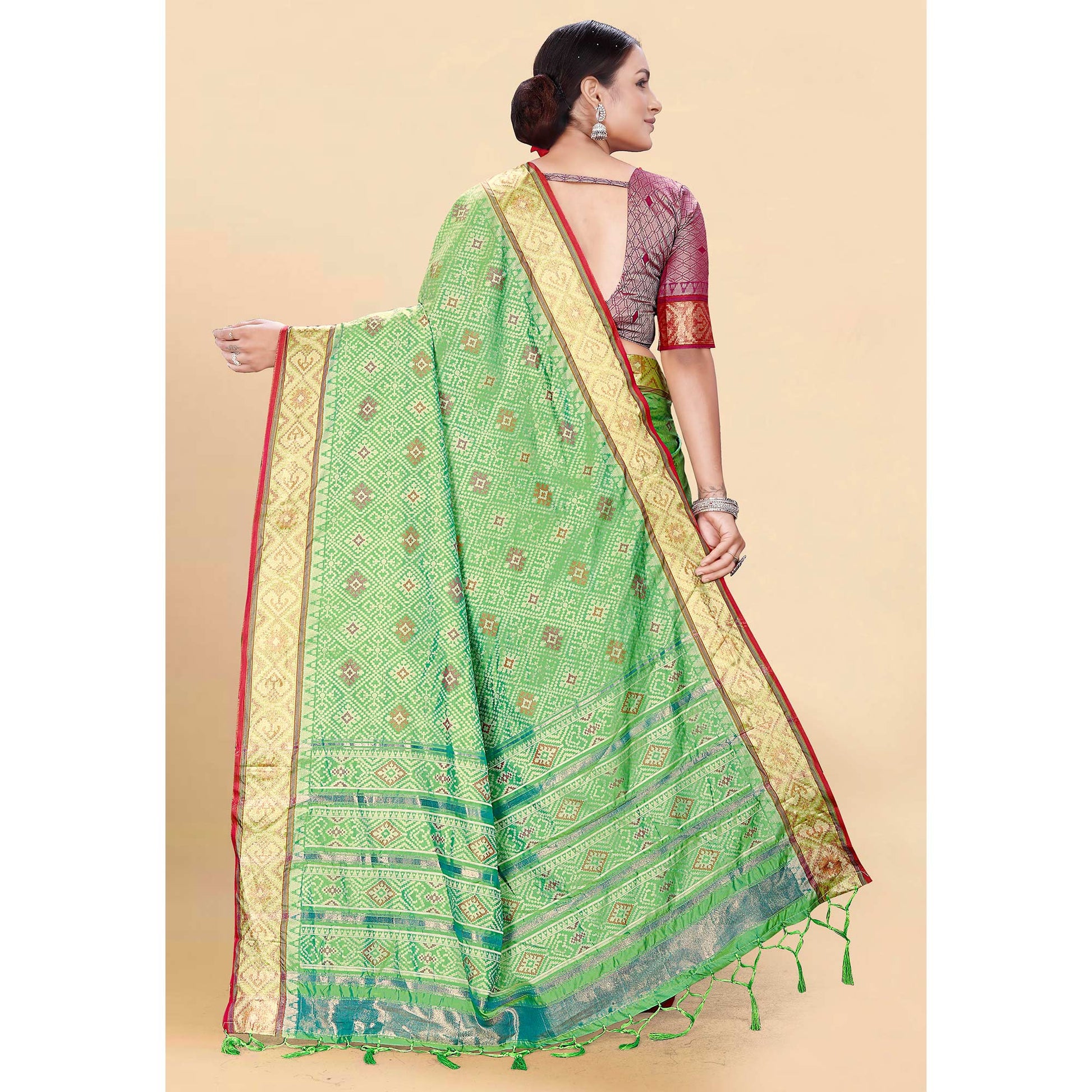 green-woven-patola-art-silk-saree-with-tassels-2