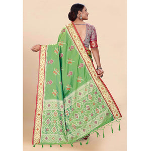 green-woven-patola-art-silk-saree-with-tassels-1