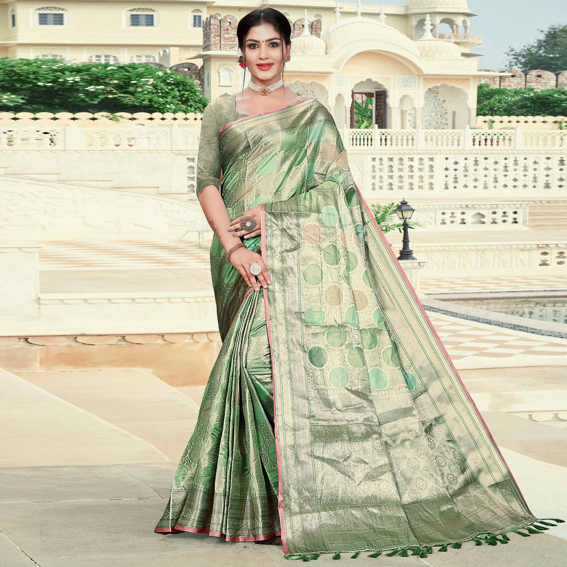 green-floral-woven-organza-saree-with-tassels