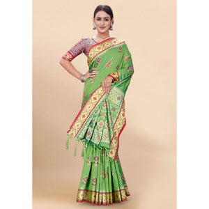 green-woven-patola-art-silk-saree-with-tassels-1