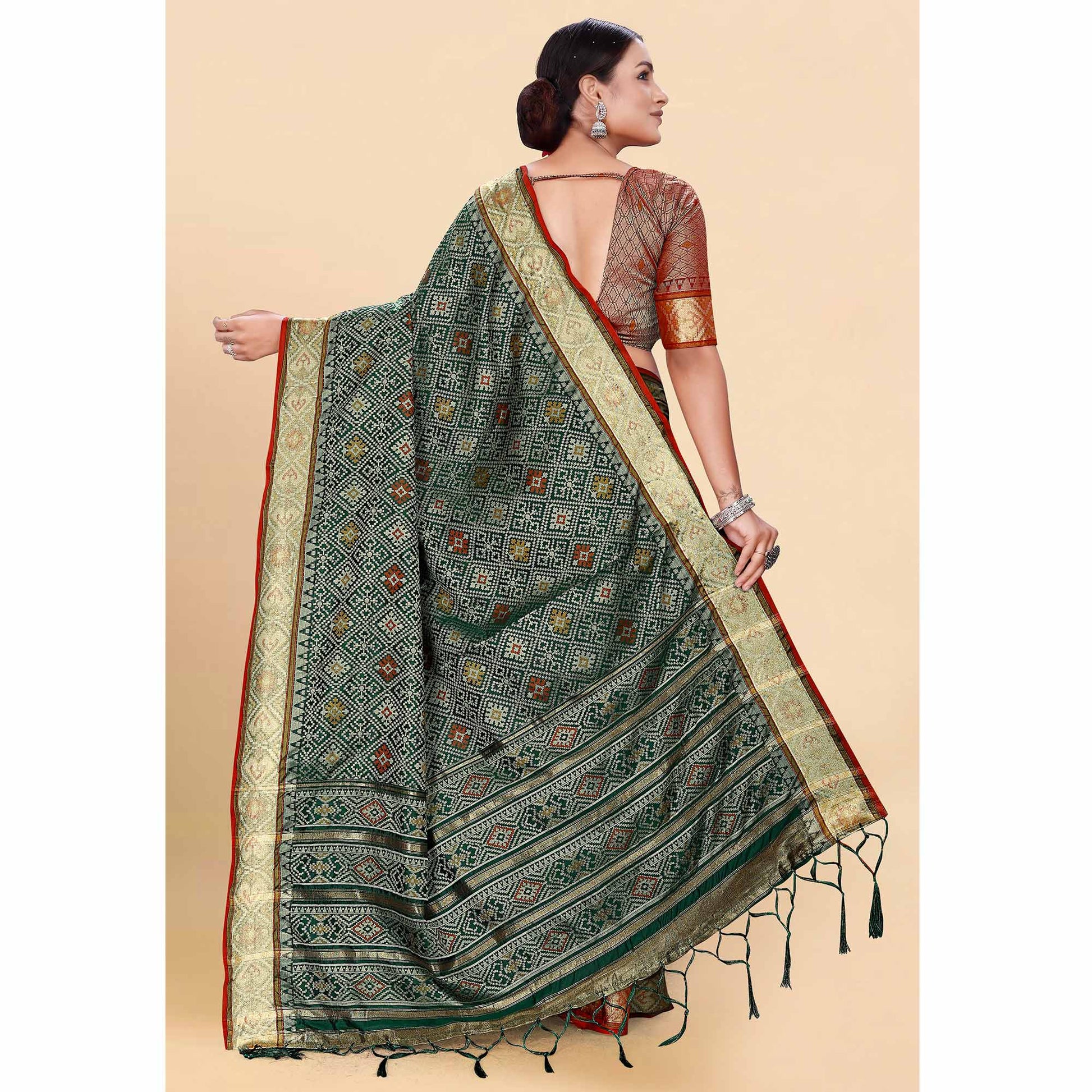 green-woven-patola-art-silk-saree-with-tassels-4