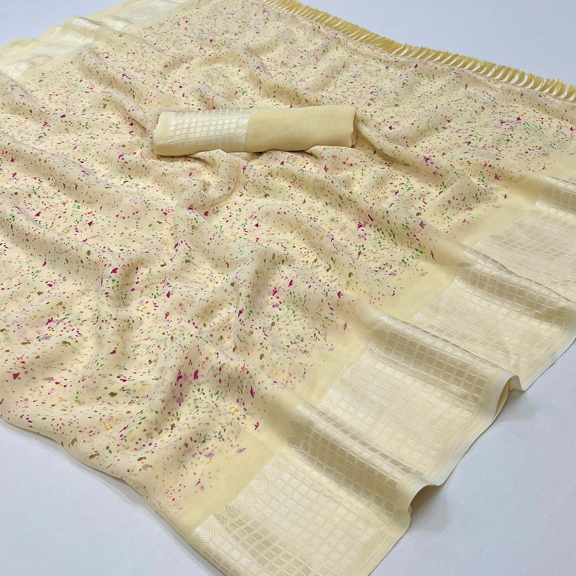 Cream Printed Georgette Saree With Tassels