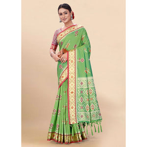 green-woven-patola-art-silk-saree-with-tassels-1