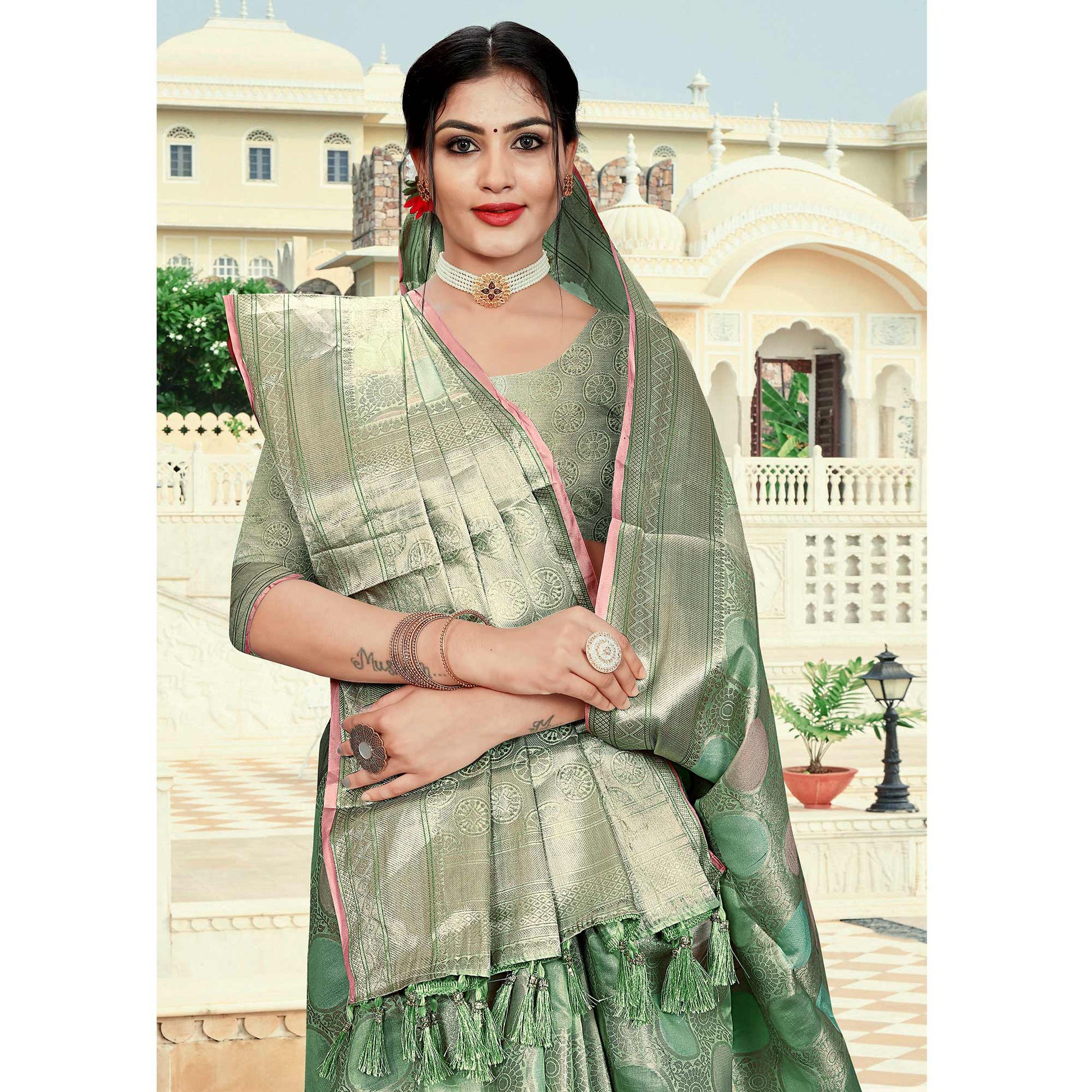 green-floral-woven-organza-saree-with-tassels