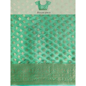 green-woven-organza-silk-saree-with-tassels