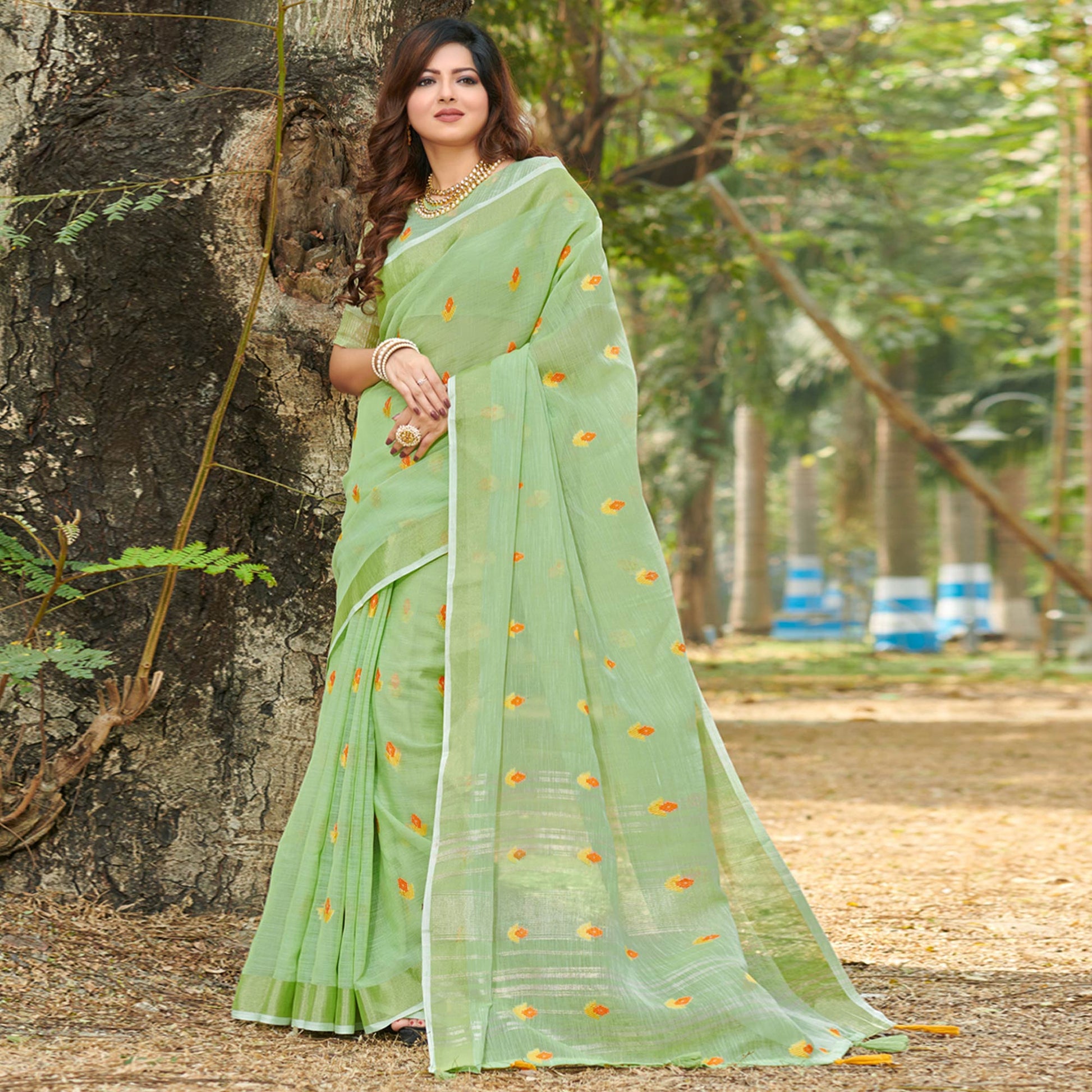 green-embroidered-linen-saree-with-tassels