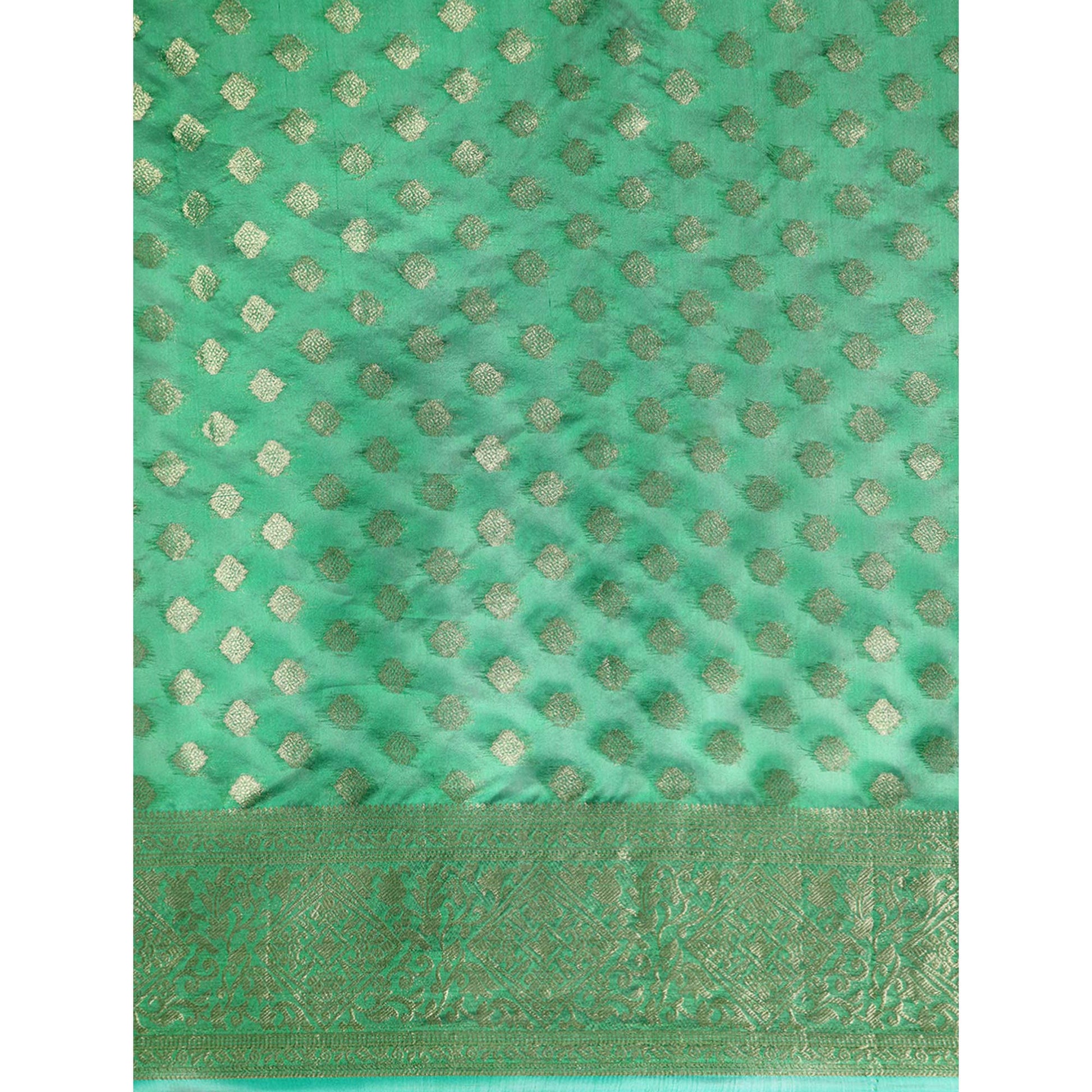 green-woven-organza-silk-saree-with-tassels