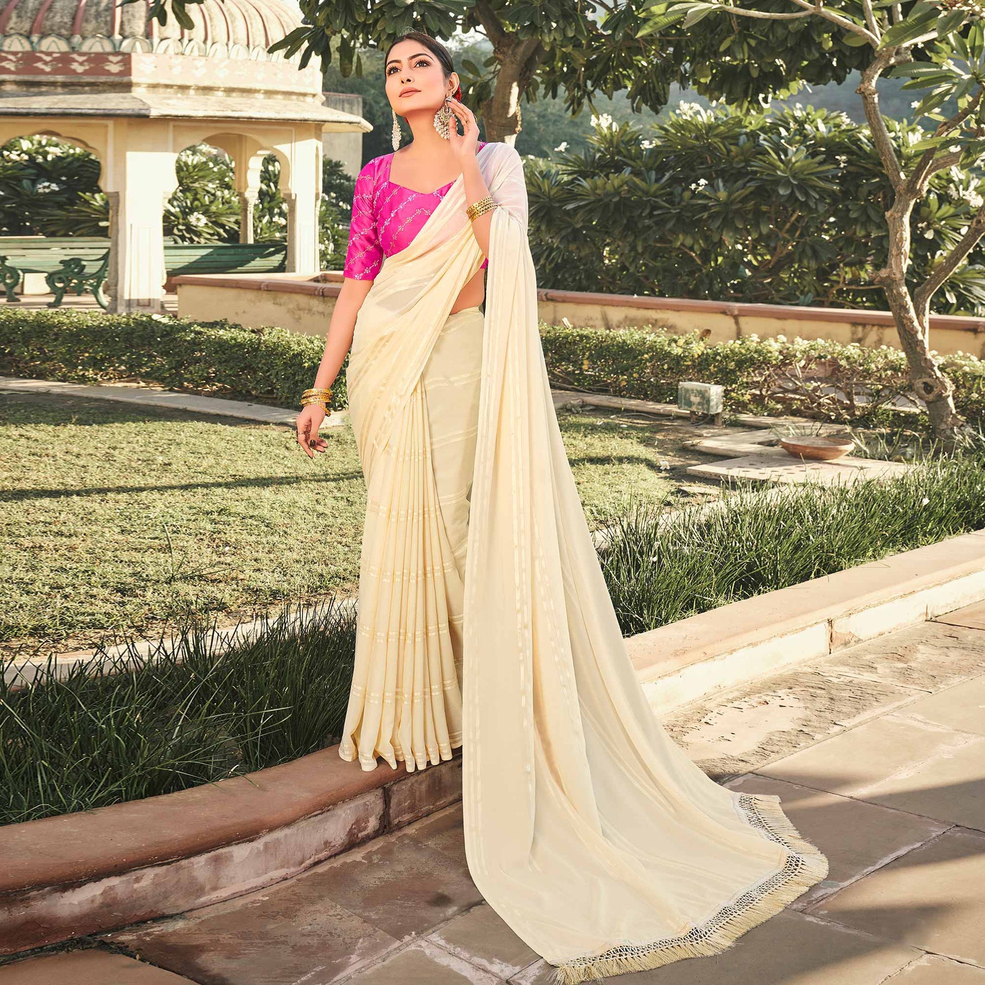 Cream Printed Georgette Saree With Tassels