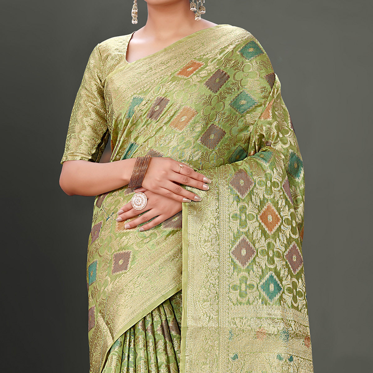 green-woven-organza-saree-with-tassels-11