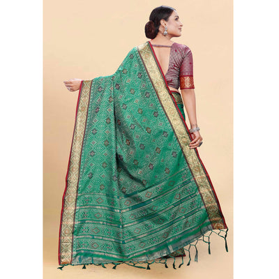 green-woven-patola-art-silk-saree-with-tassels-3