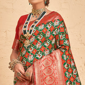 green-woven-patola-art-silk-saree-with-tassels