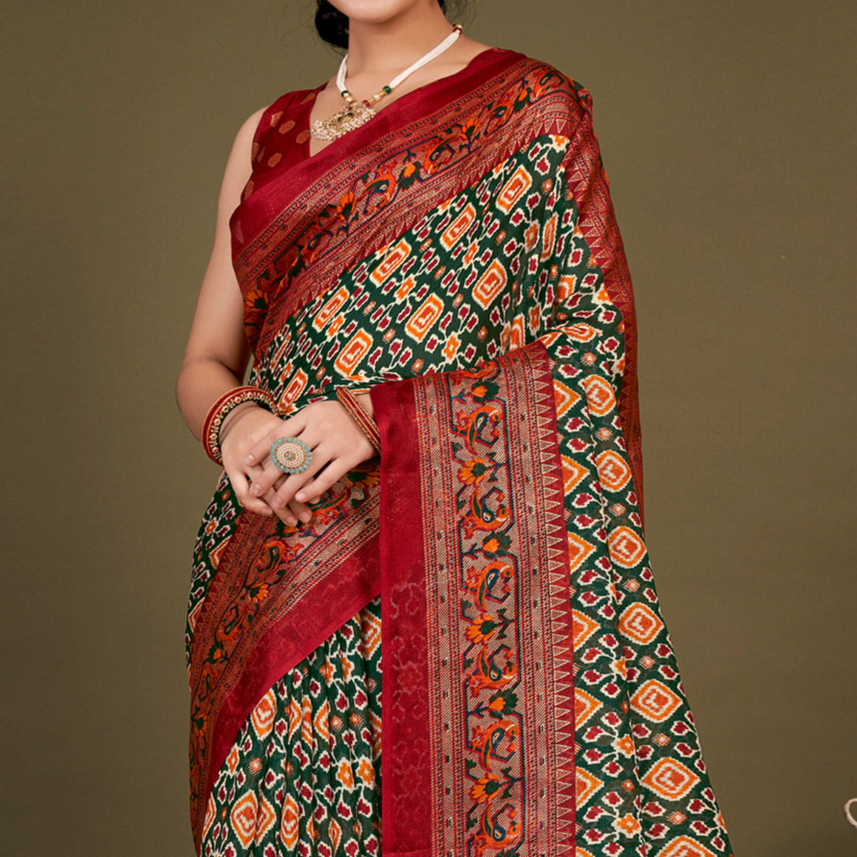 green-printed-jute-patola-saree-with-tassels-1